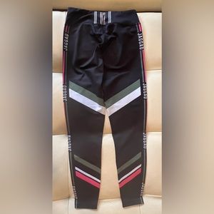 Jaggad leggings, size Medium, black with contrast flashes.